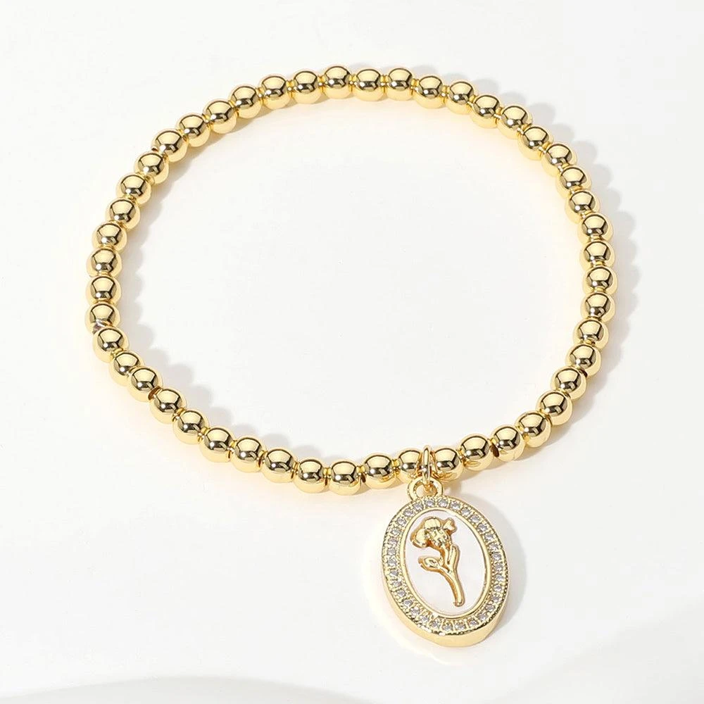 FASHNZFAB Stainless Steel Stone Paved Tulip Flower Embossed Mother of Pearl Oval Charm Beaded Stretch Bracelet Gold, Mother of Pearl
