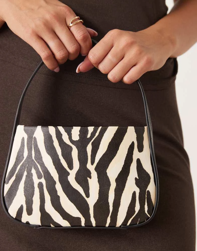 ASOS ASOS DESIGN mini grab clutch bag in zebra print 3