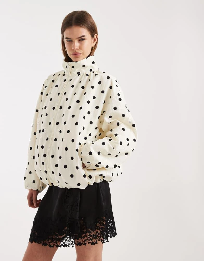 ASOS ASOS DESIGN oversized bubble hem track jacket in polka dot