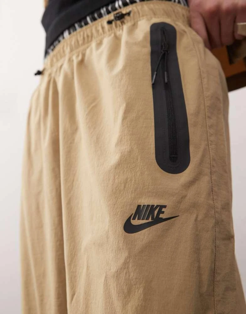 NIKE Nike Tech woven trouser in beige 2