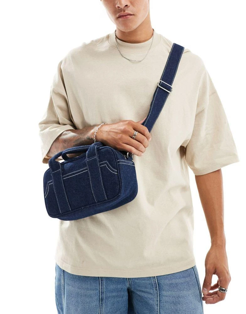 ASOS ASOS DESIGN bowler cross body bag with contrast stitch in navy denim 1