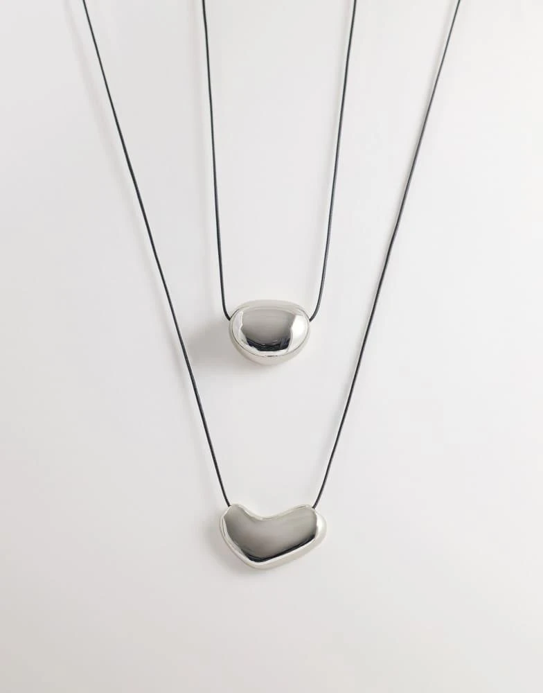 ASOS ASOS DESIGN multi-row pendant necklaces with metal detailing in silver tone