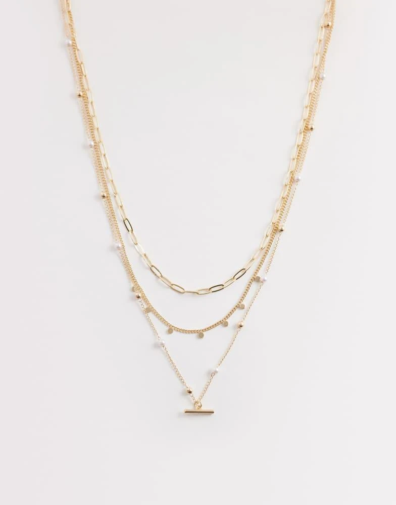 ASOS ASOS DESIGN multi-row necklace with faux pearls and t-bar detail in gold tone