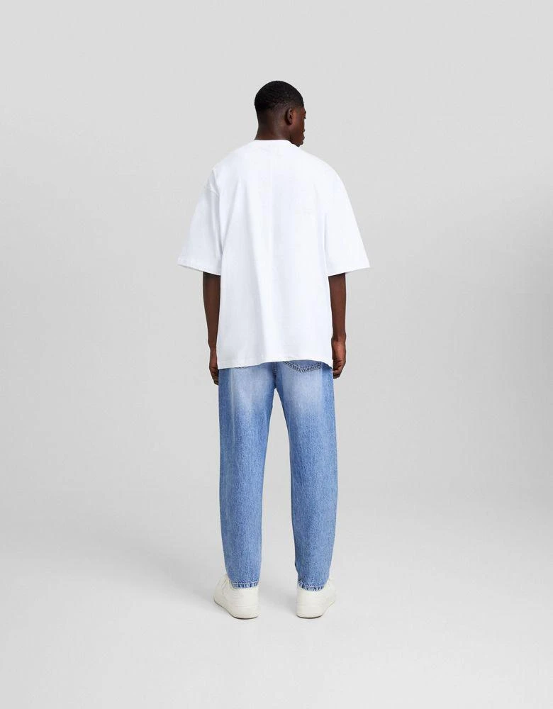 Bershka Bershka loose fit jeans in mid washed blue 4