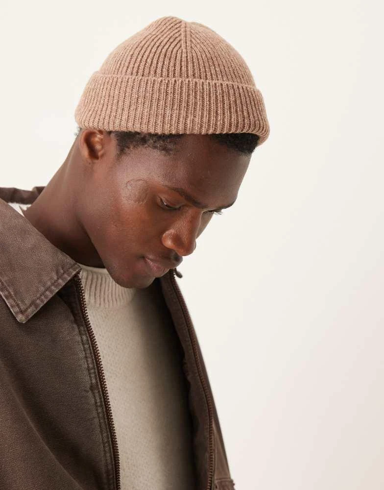 ASOS ASOS DESIGN lambswool mini fisherman ribbed beanie in brown 1