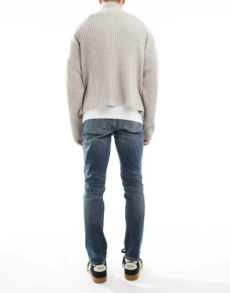ASOS ASOS DESIGN skinny jeans with green tint in light wash blue 3