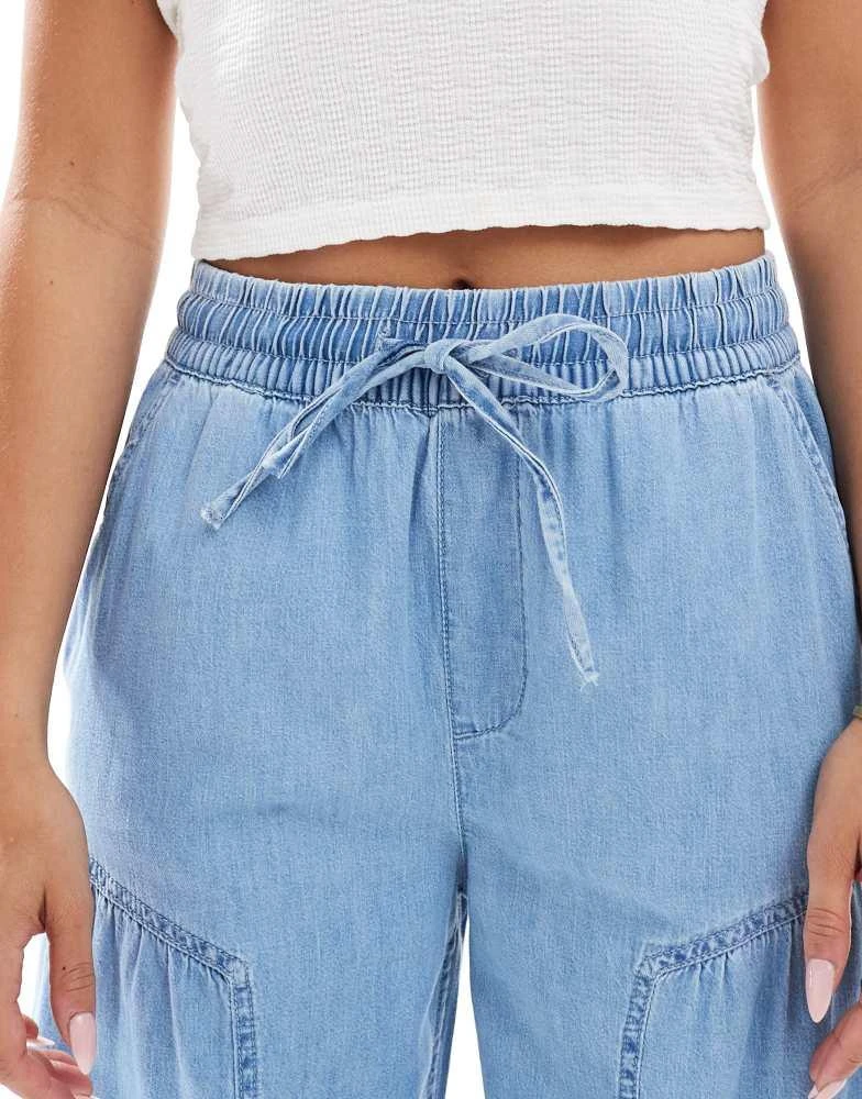 ASOS ASOS DESIGN soft wide leg pull on jean with stitch detail in mid blue 5