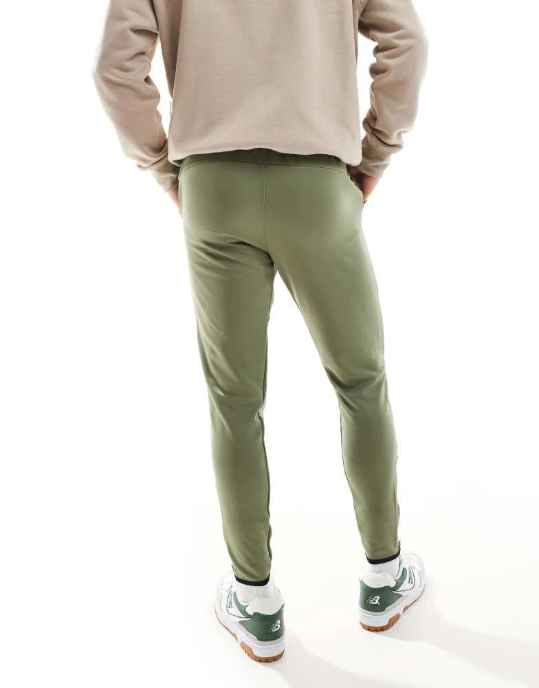 New Balance New Balance Tenacity knit training pant in green 4