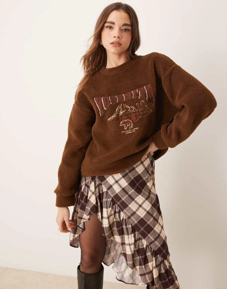 ASOS ASOS DESIGN Yosemite embroidered borg sweatshirt in brown 1