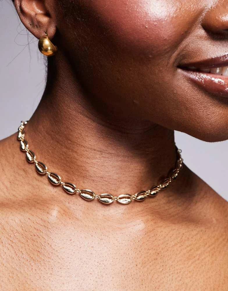 ASOS ASOS DESIGN choker necklace with faux shell design in gold 1