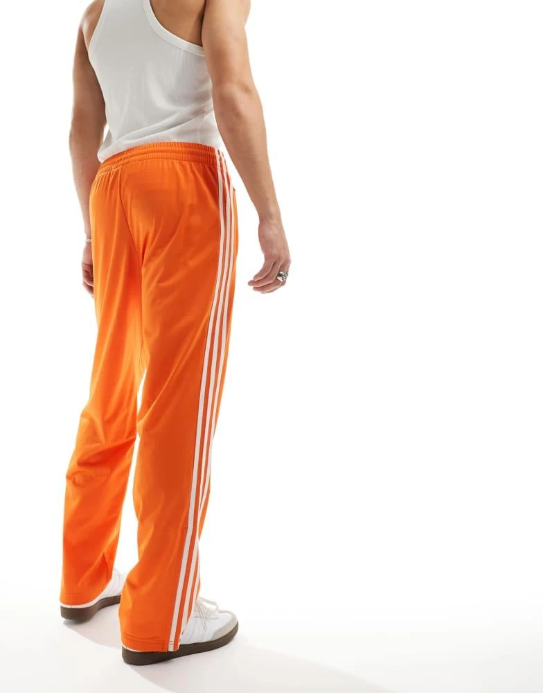 adidas Originals adidas Originals Firebird track pants in orange 3