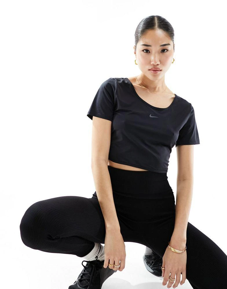 Shop Nike One Training Dri-FIT slim twist back crop t-shirt in