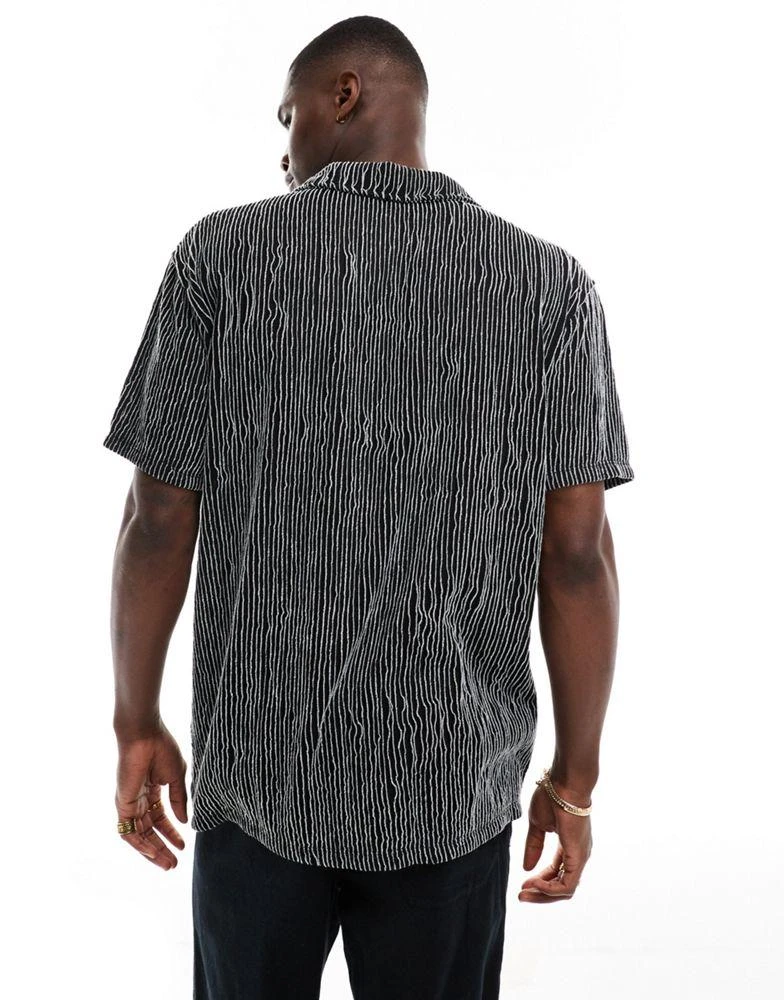 ASOS ASOS DESIGN relaxed revere polo in black textured stripe 3