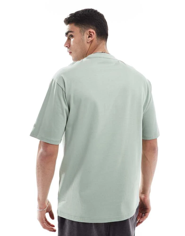 New Era New Era flag logo oversized t-shirt in green 4