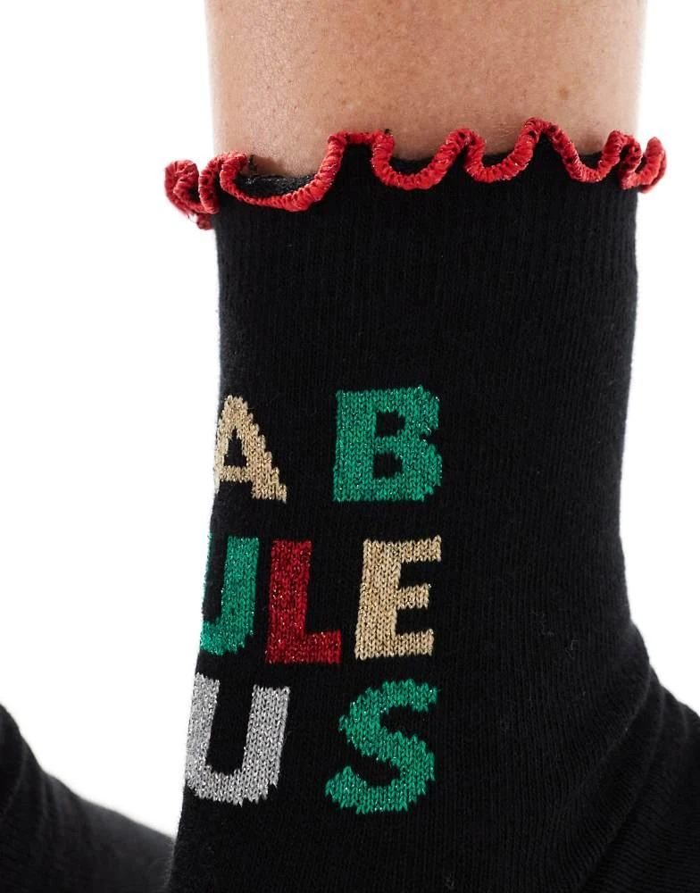 ASOS ASOS DESIGN Christmas slogan sock with frill edge in black 2
