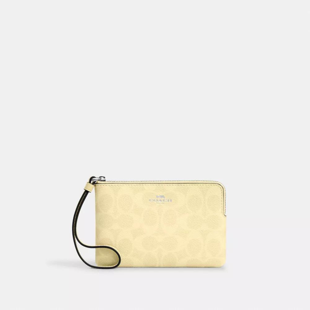 Coach Corner Zip Wristlet In Signature Canvas