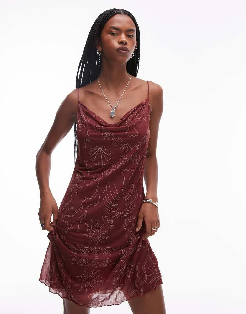 Shop Topshop crinkle cowl neck sea print mini dress in burgundy on