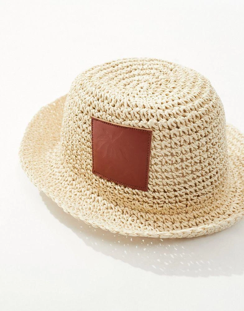 ASOS ASOS DESIGN straw crochet bucket hat with faux leather patch 2