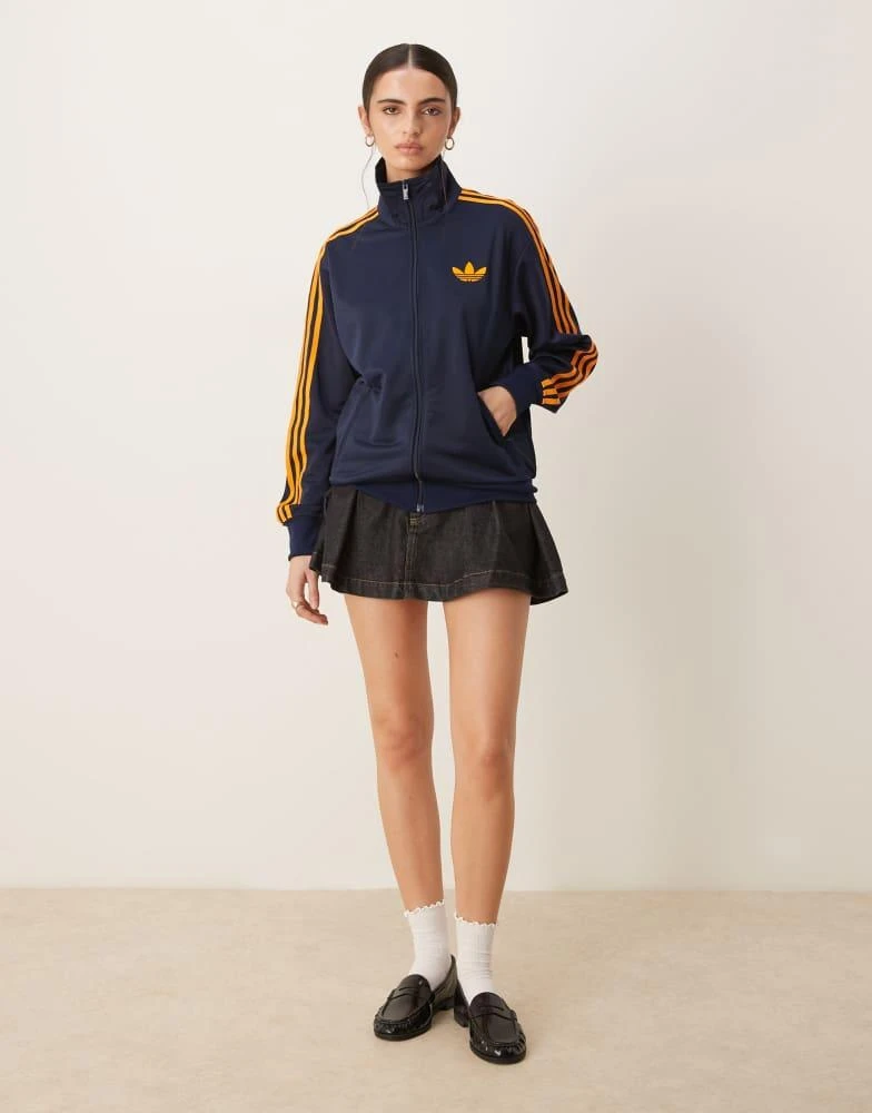Adidas adidas Originals Firebird Loose track top in navy and orange 2