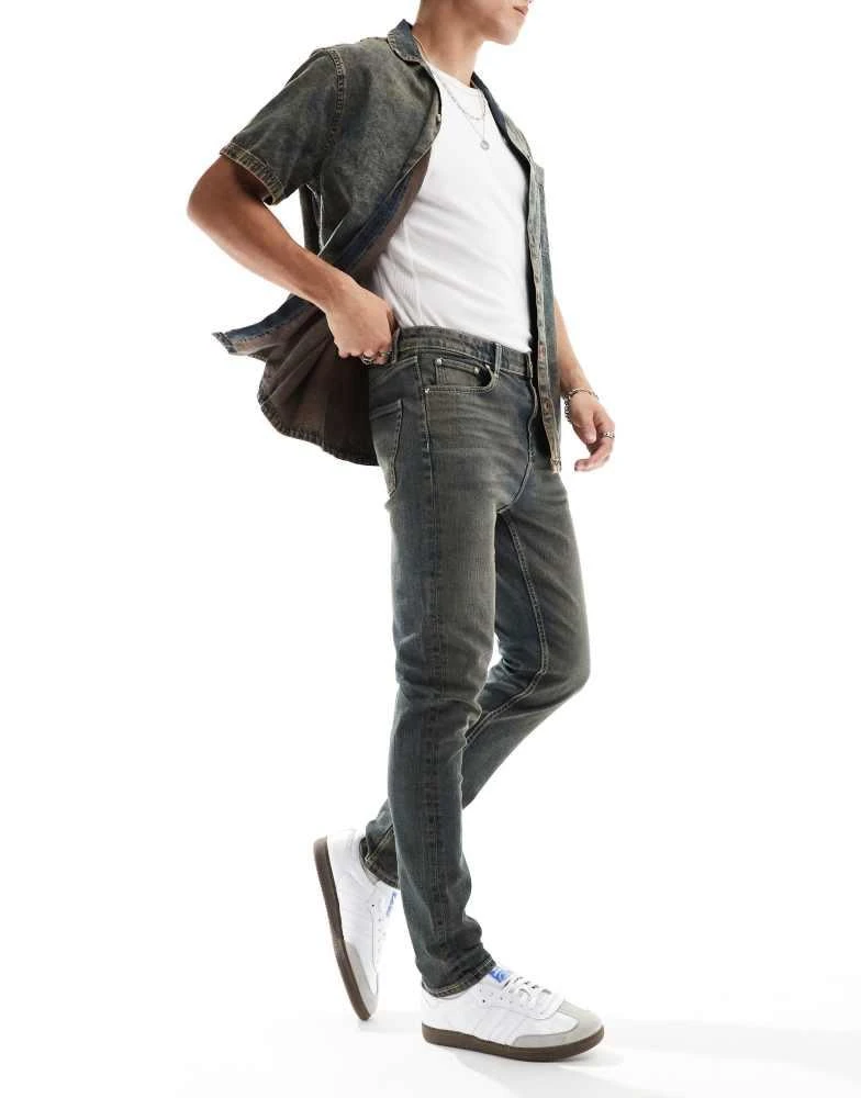 ASOS ASOS DESIGN skinny jeans in dark wash blue with tint 1