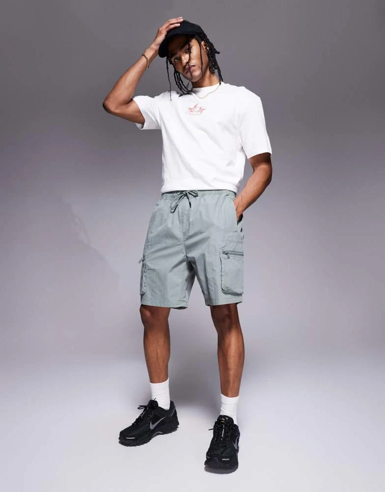 River Island River Island stretch cargo shorts in light green 1