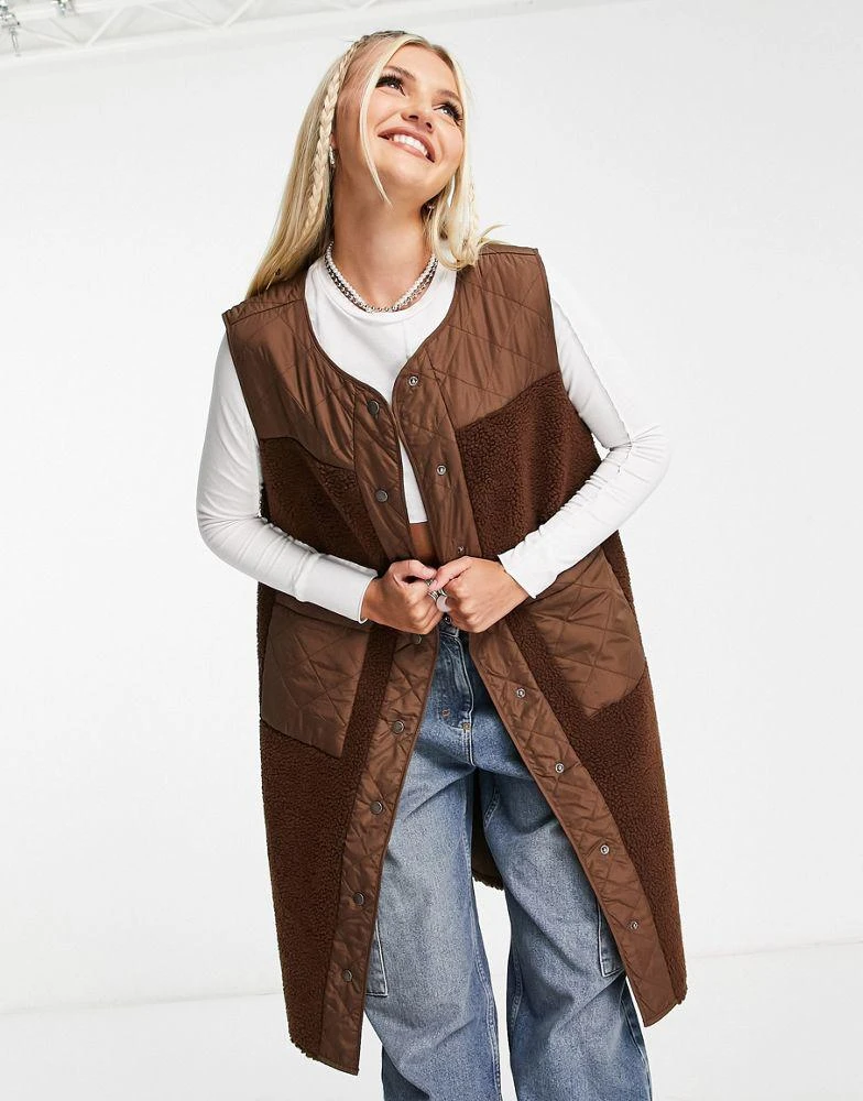 Noisy May Noisy May longline mixed quilted and teddy gilet in brown 1