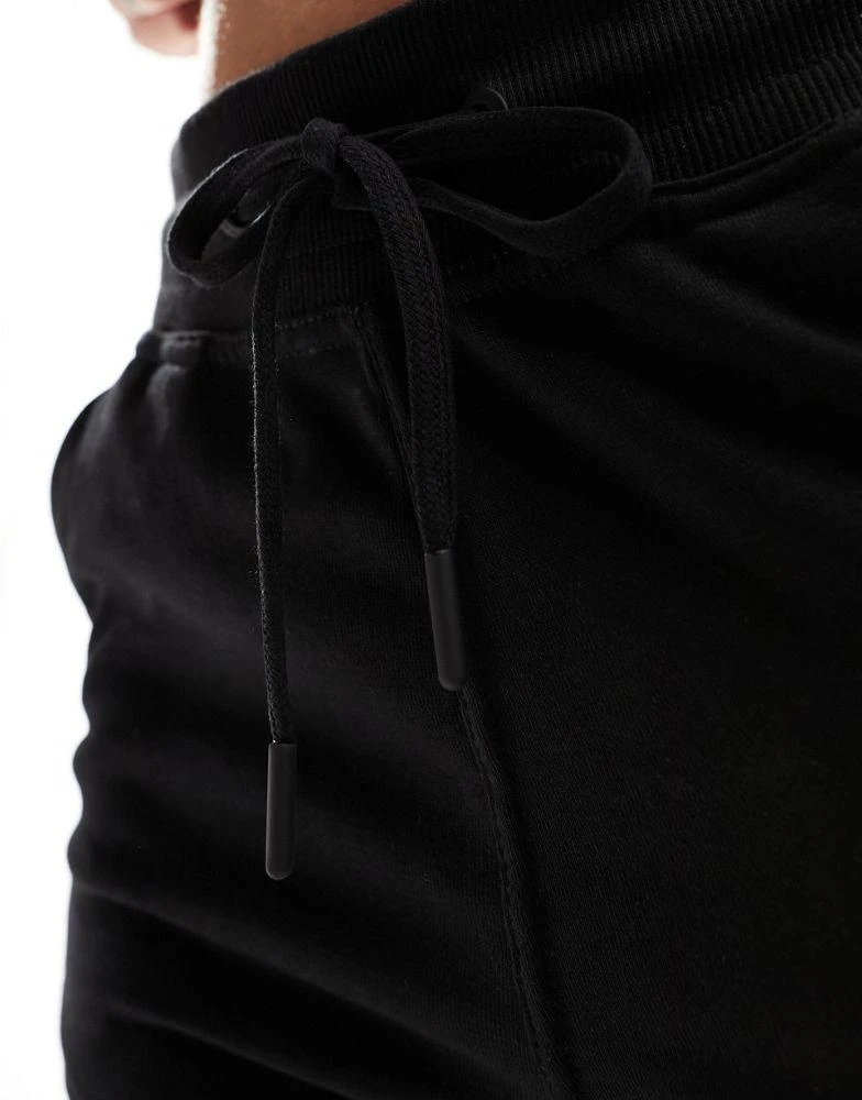 Bershka Bershka joggers in washed black 5