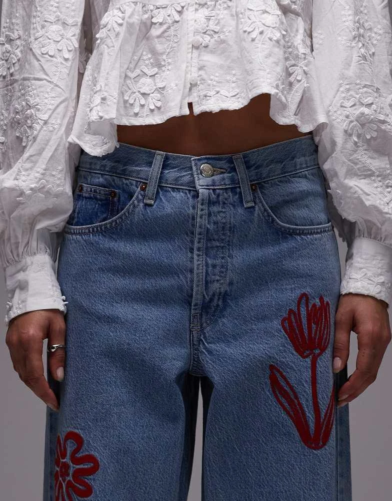 Topshop Topshop mid rise loose fit jean with red floral embroidery in mid blue 5