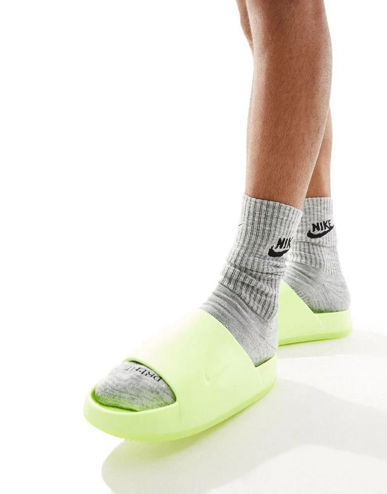 NIKE Nike Calm Sliders in bright green 1