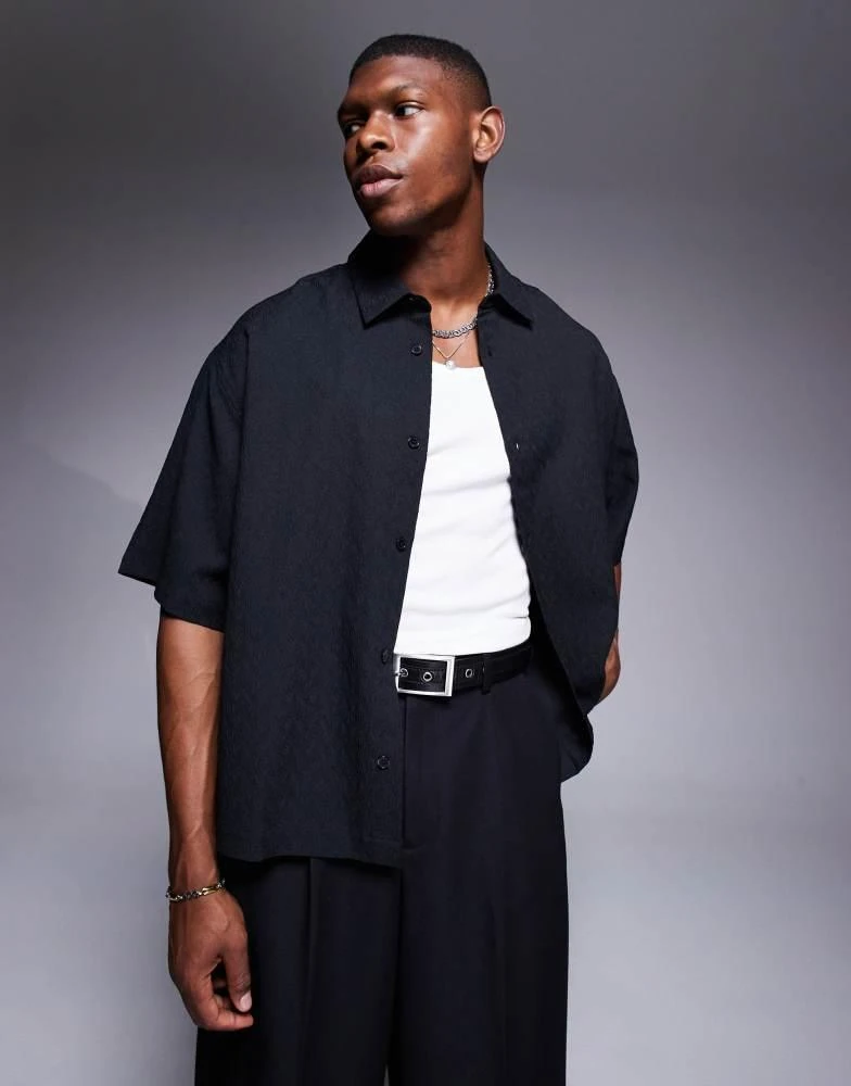 ASOS ASOS DESIGN boxy oversized textured shirt with press studs in black 1
