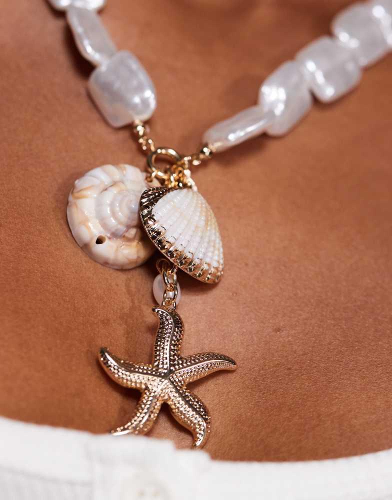 8 Other Reasons 8 Other Reasons statement shell starfish necklace in gold