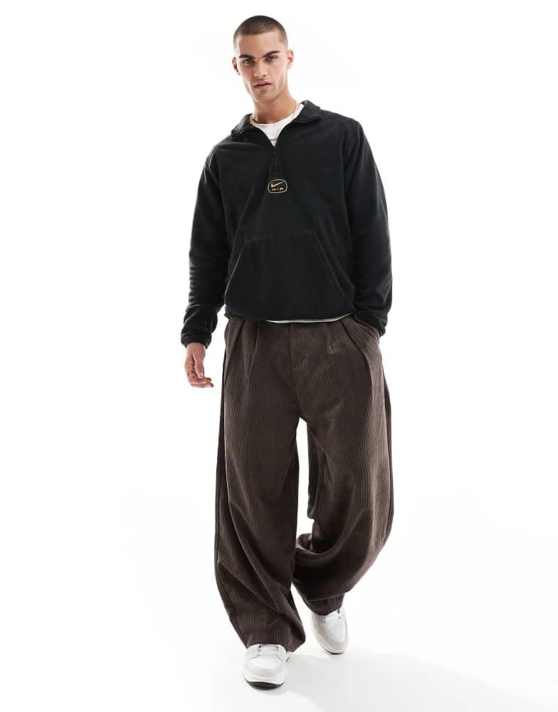 NIKE Nike Swoosh Air polar fleece half zip sweatshirt in black and gold 3