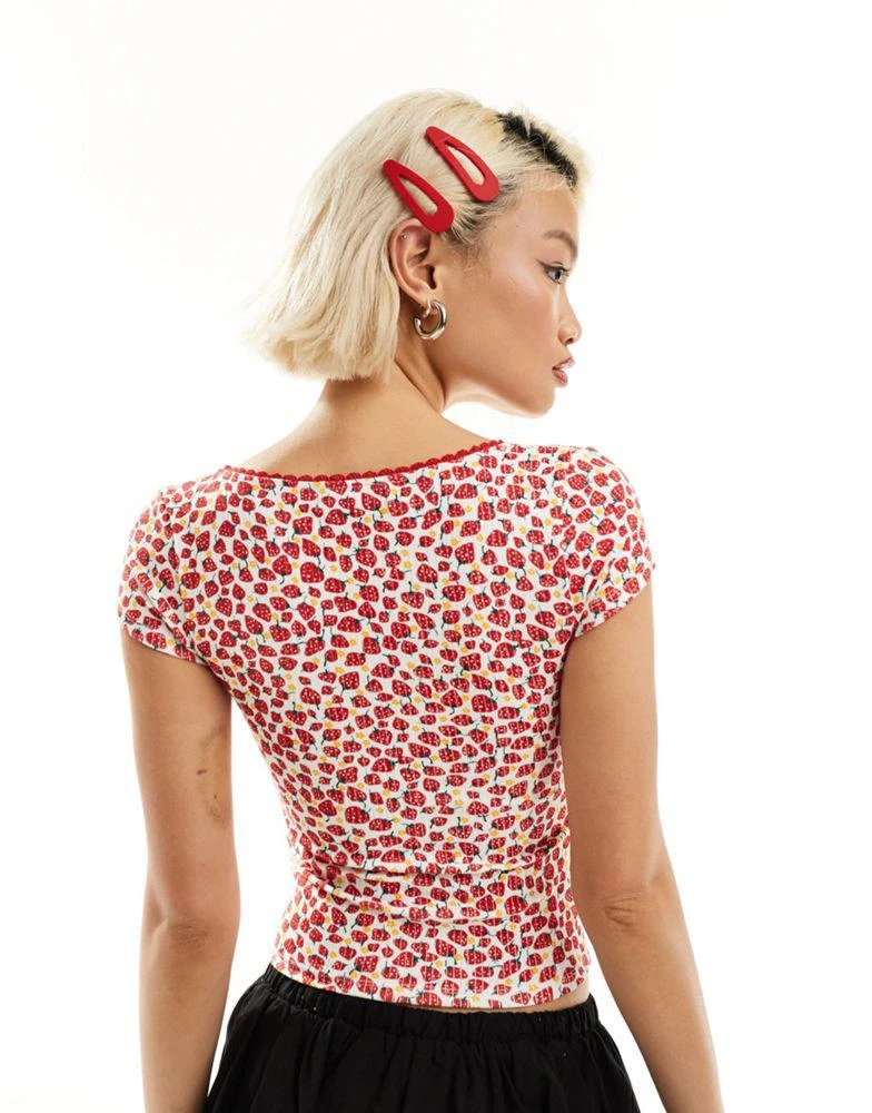 Motel Motel strawberry print bow detail top in white and red 3