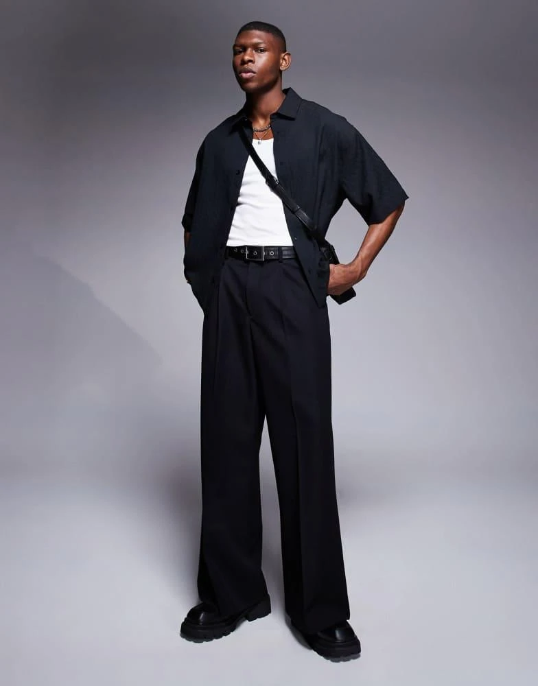 ASOS ASOS DESIGN boxy oversized textured shirt with press studs in black 2