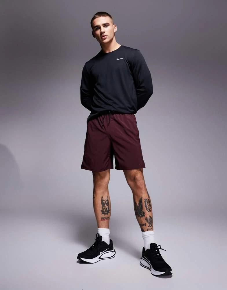 NIKE Nike Training Dri-Fit Unlimited woven 7 inch shorts in burgundy 1