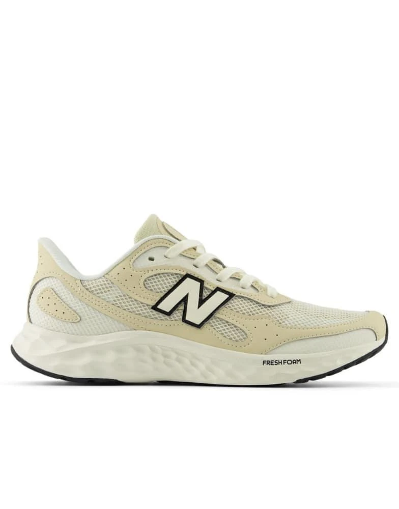 Shop New Balance Fresh foam arishi v4 trainers in beige on  display picture 1