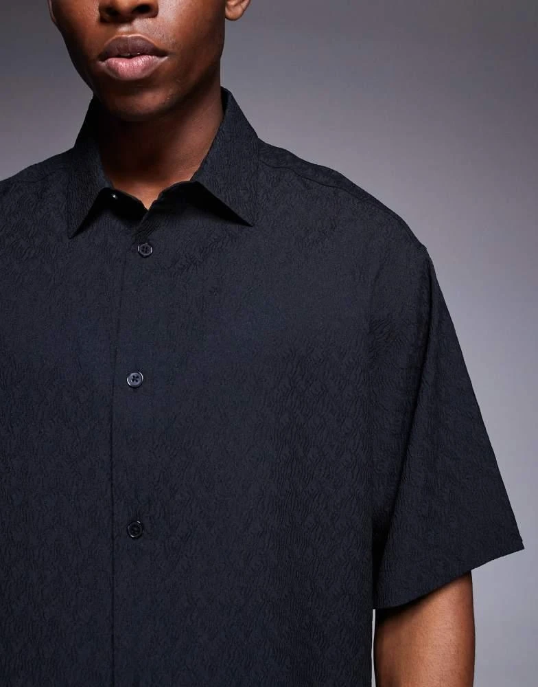 ASOS ASOS DESIGN boxy oversized textured shirt with press studs in black 3