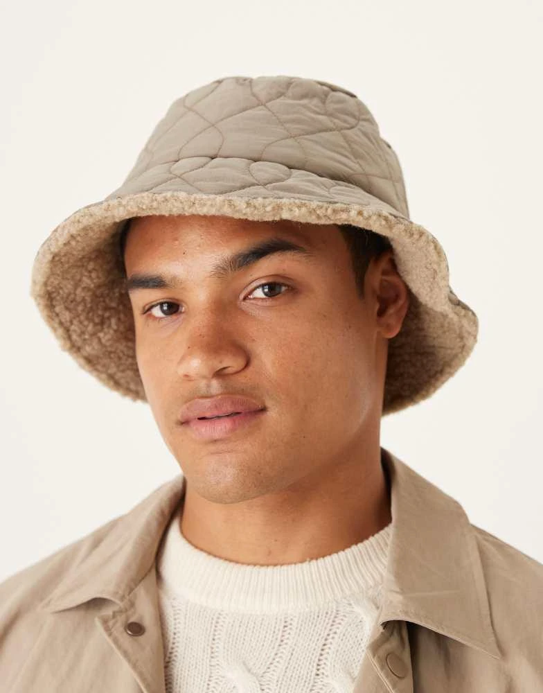 ASOS ASOS DESIGN padded and borg reversible bucket hat in neutral from ASOS