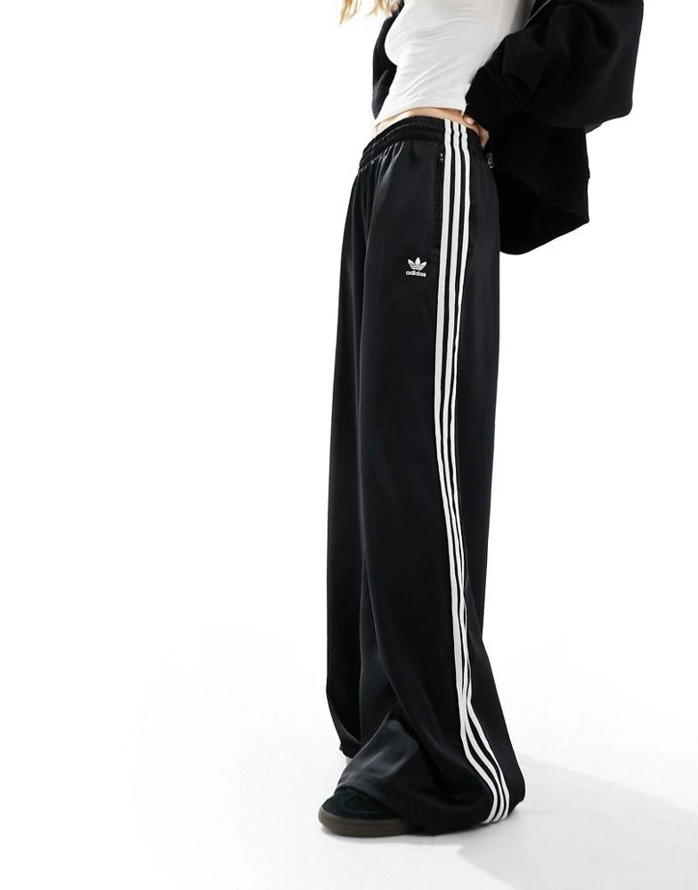 Adidas adidas Originals wide leg satin joggers in black 1