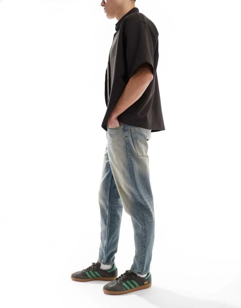 ASOS ASOS DESIGN tapered jeans with tint in light wash blue 2
