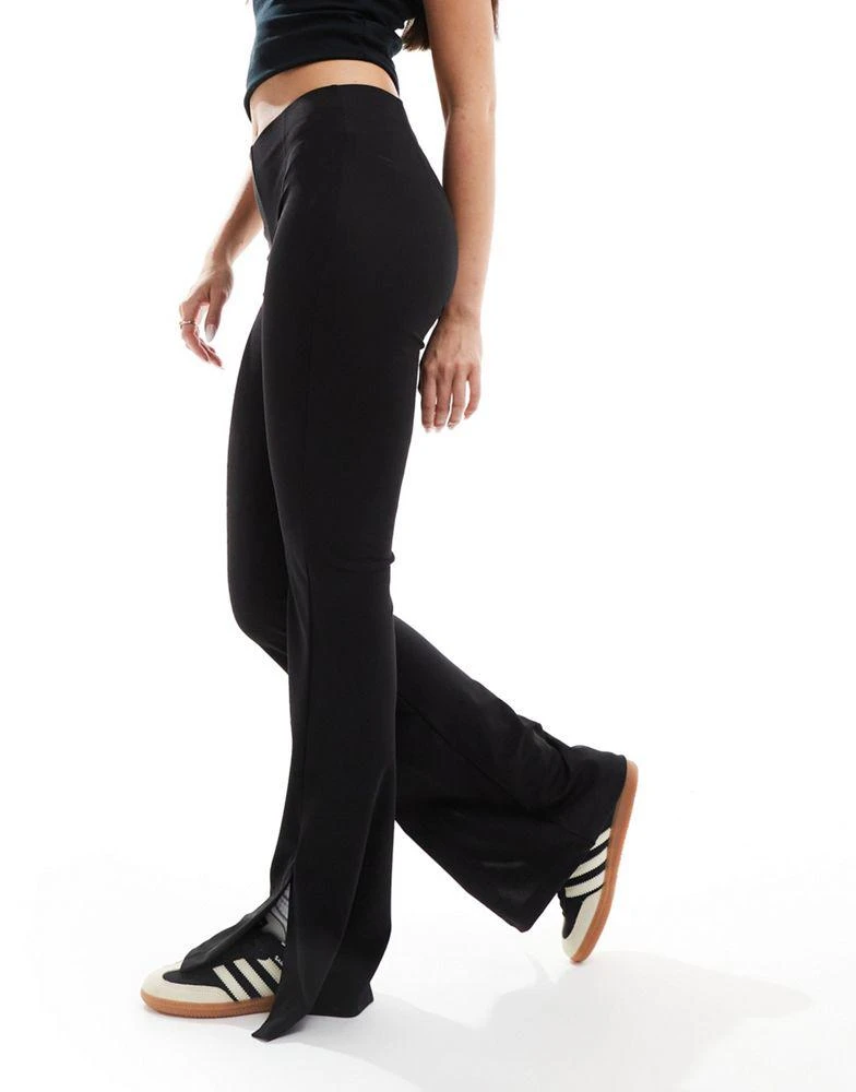 Bershka Bershka high waisted jersey flared trousers in black 5