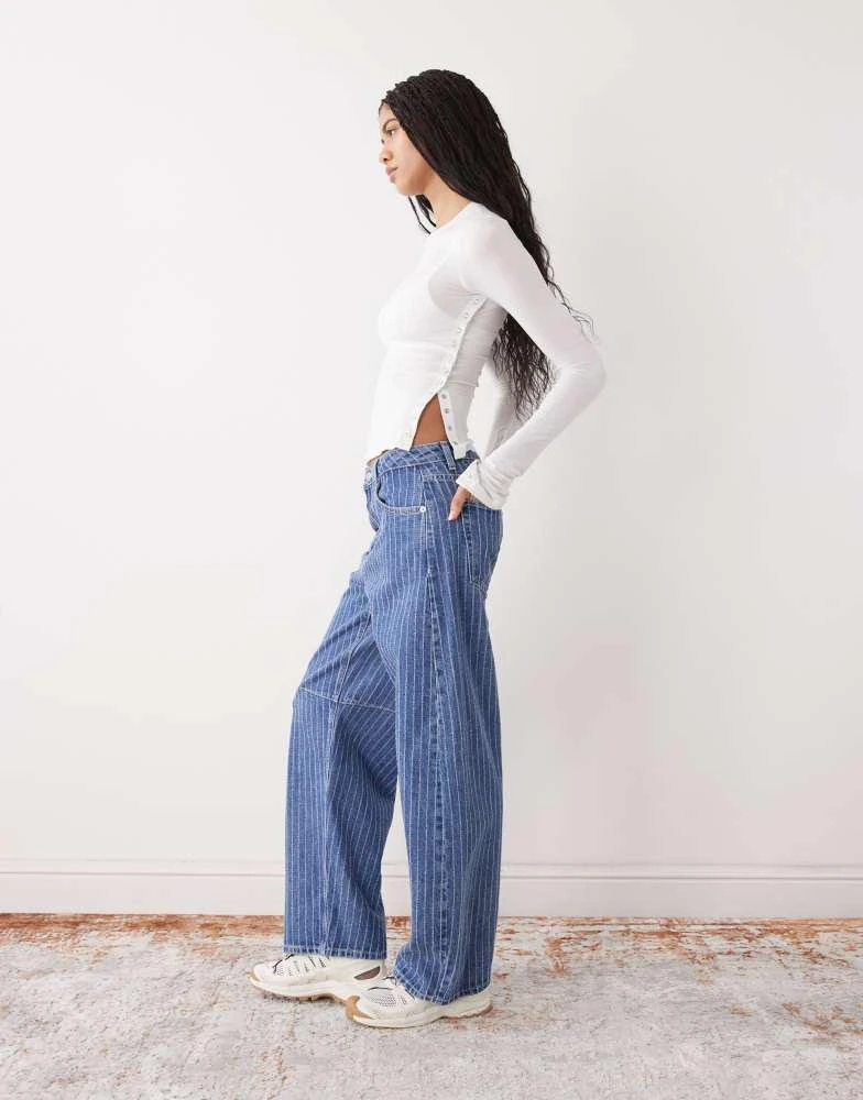 Weekday Weekday long sleeve fitted top with button detailing and asymmetric hem in off white 2