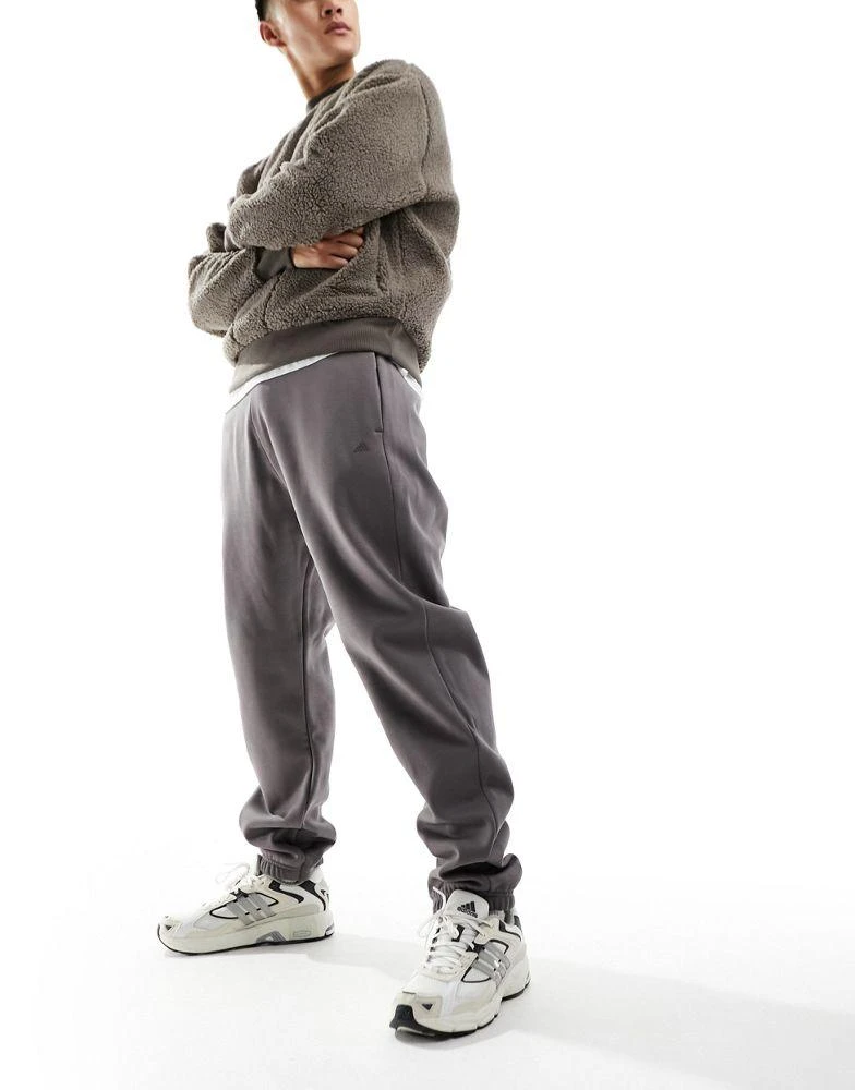 Adidas adidas Basketball One joggers in dark brown 1