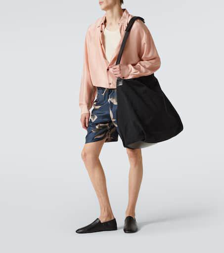 Shop Leather-trimmed canvas shoulder bag on Sale at BeyondStyle
