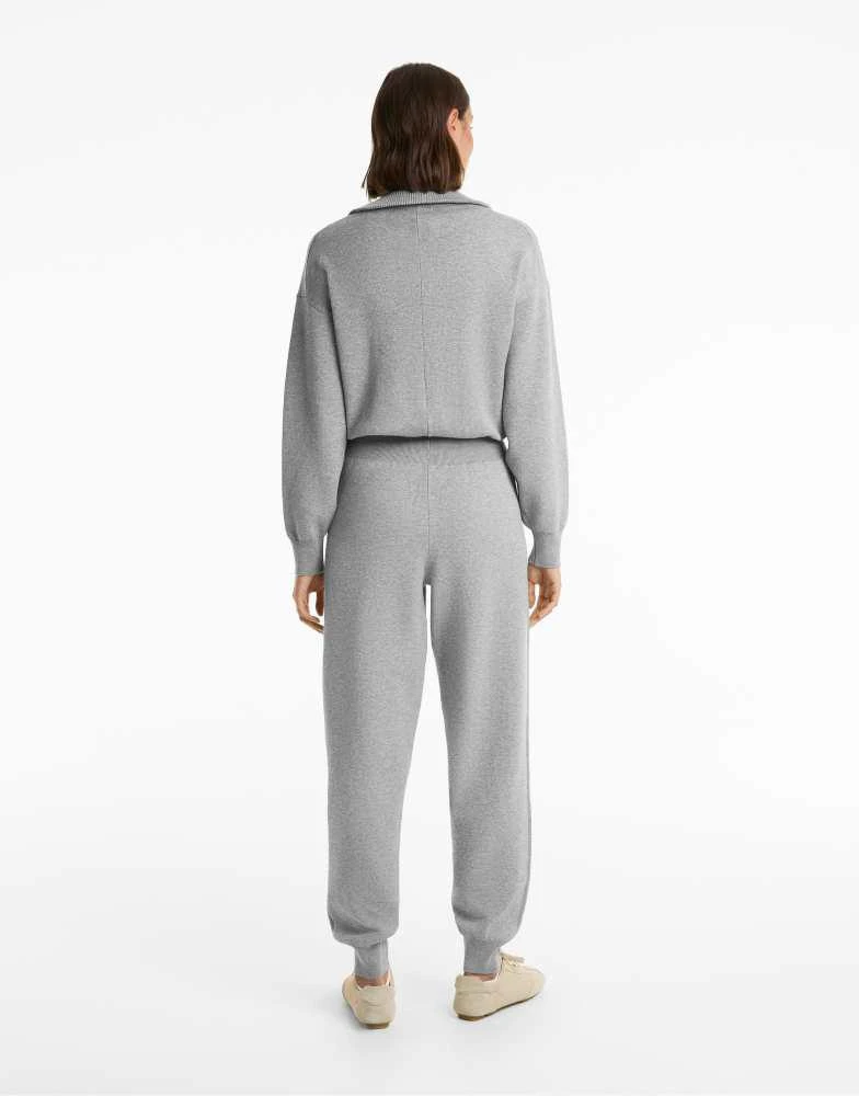 OYSHO OYSHO Half-zip long knit jumpsuit in black 3