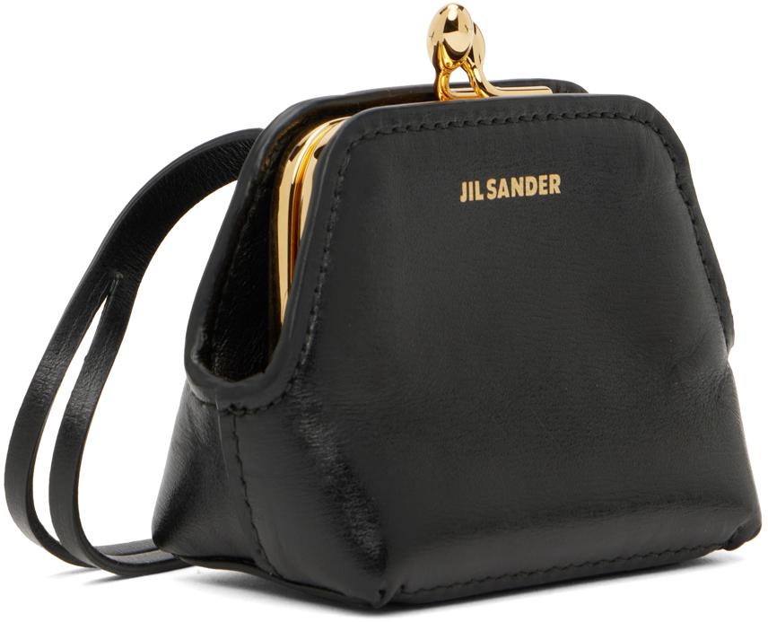 【送料&関税込】Jil Sander Black Shearling Clutch Jil Sander Black shearling clutch - Handbags - Compare