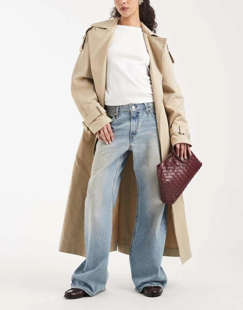 Levi
s Levi
s loose bootcut jeans in yellow tint mid blue