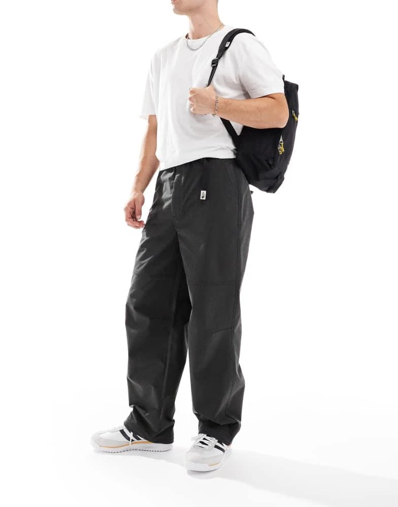 The North Face The North Face M66 Tek Heritage wide leg woven trousers in black 1
