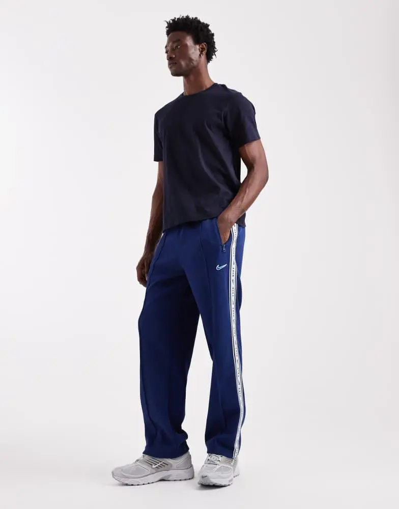 NIKE Nike striped tapered joggers in navy
