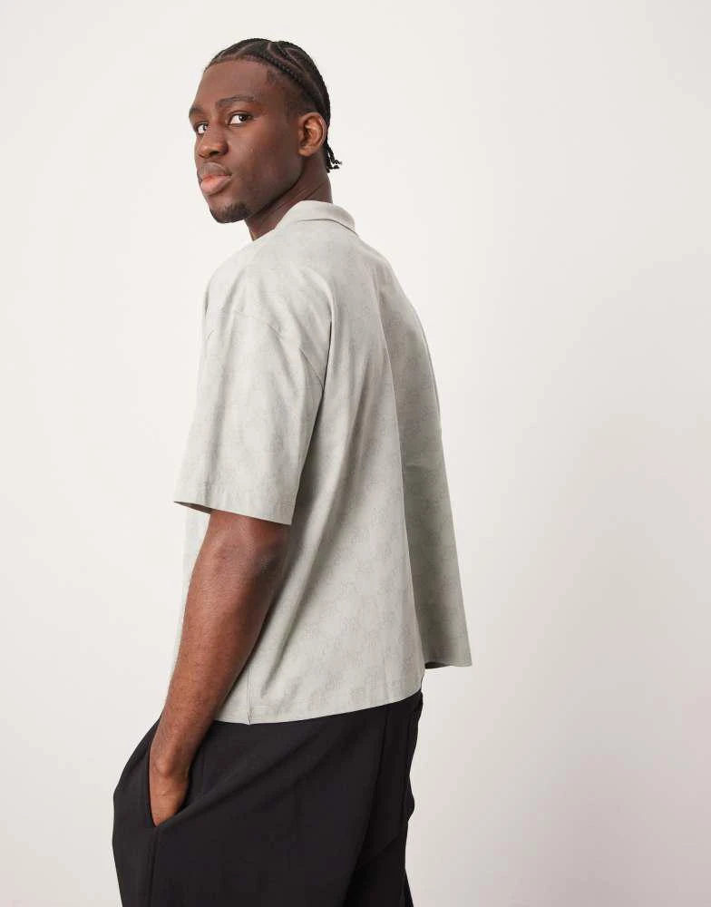 ASOS ASOS DESIGN boxy oversized polo with sports graphic in grey 3